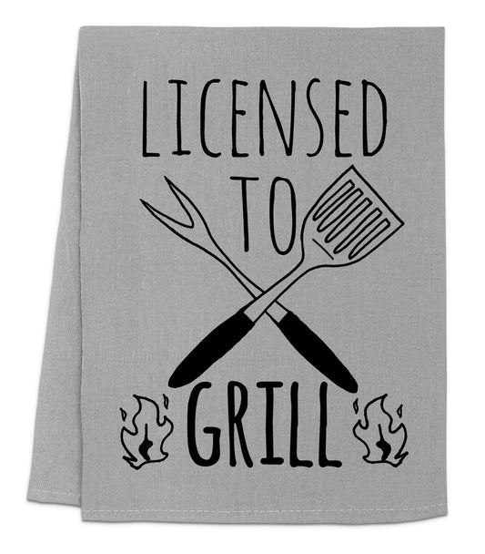 a towel that says, license to grill