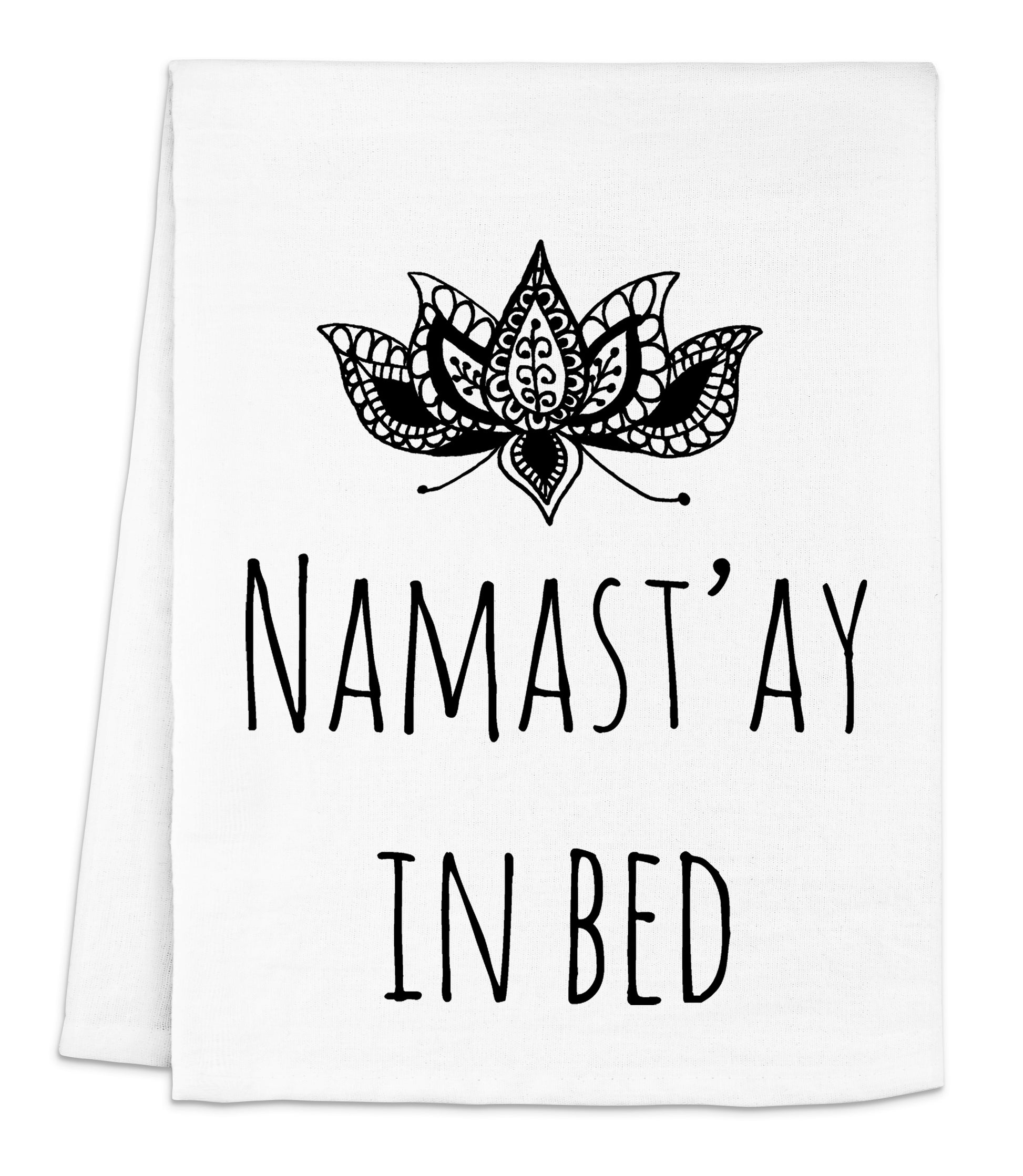 a tea towel with the words namast'ay in bed printed on it