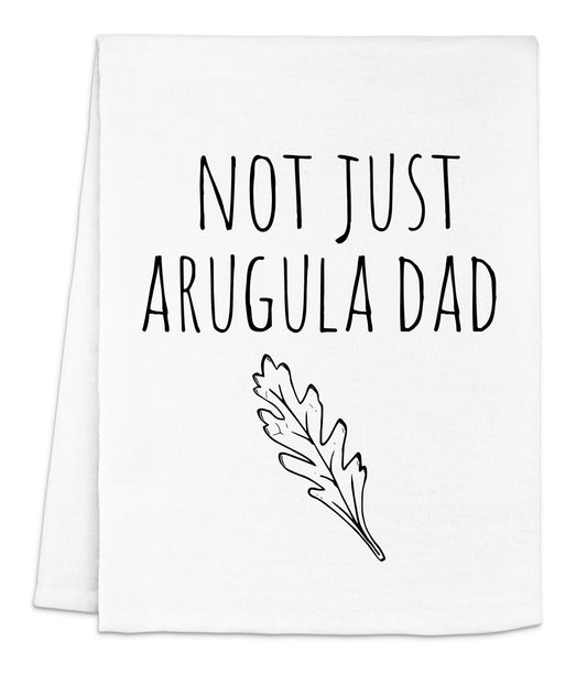 a white dish towel with black lettering that says not just arugula dad