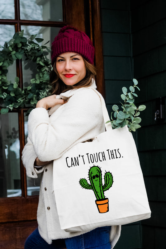 a woman carrying a bag that says can't touch this