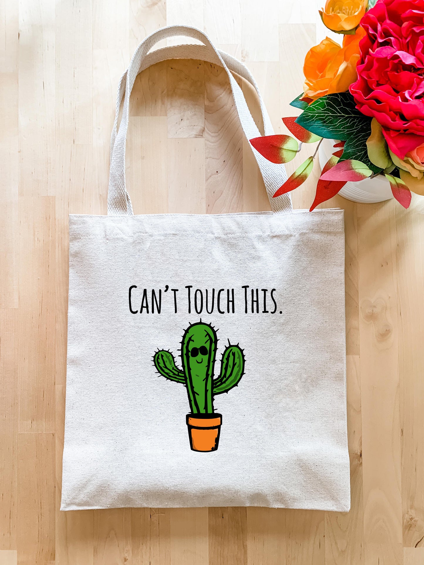 a white tote bag with a cactus on it