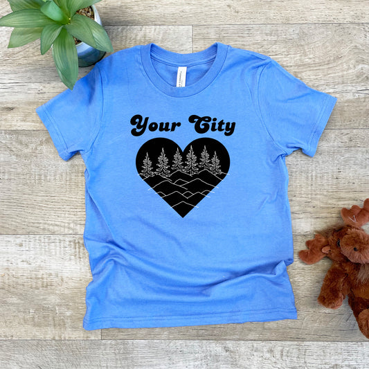 a blue t - shirt with a heart and trees on it