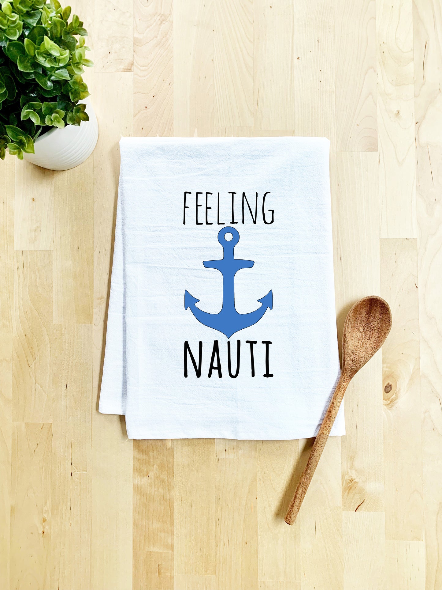 a tea towel that says feeling nauti with an anchor on it