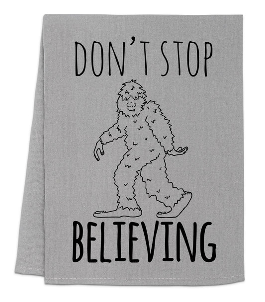 a towel with a drawing of a bigfoot saying don't stop believing