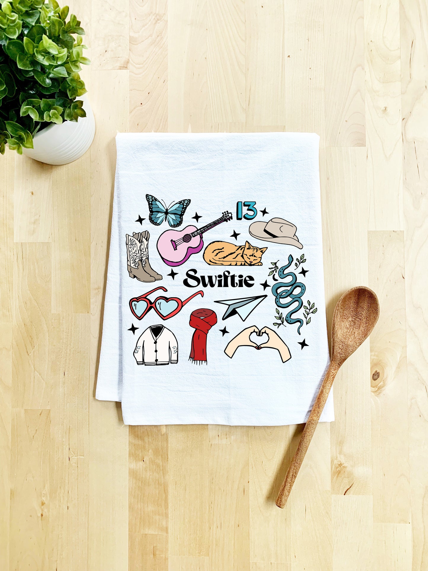 a tea towel with a picture of various items on it