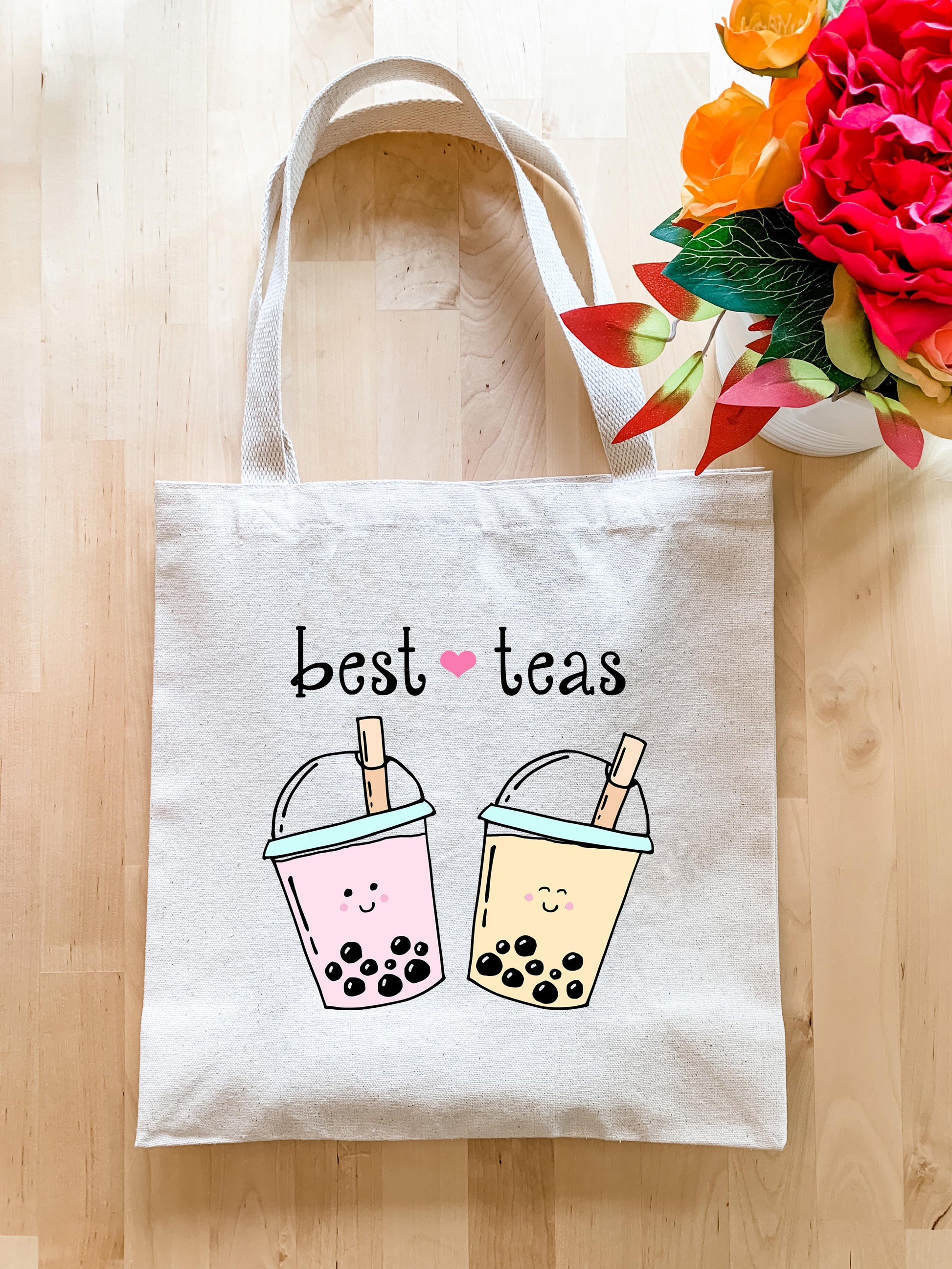 a tote bag with two cups of tea on it