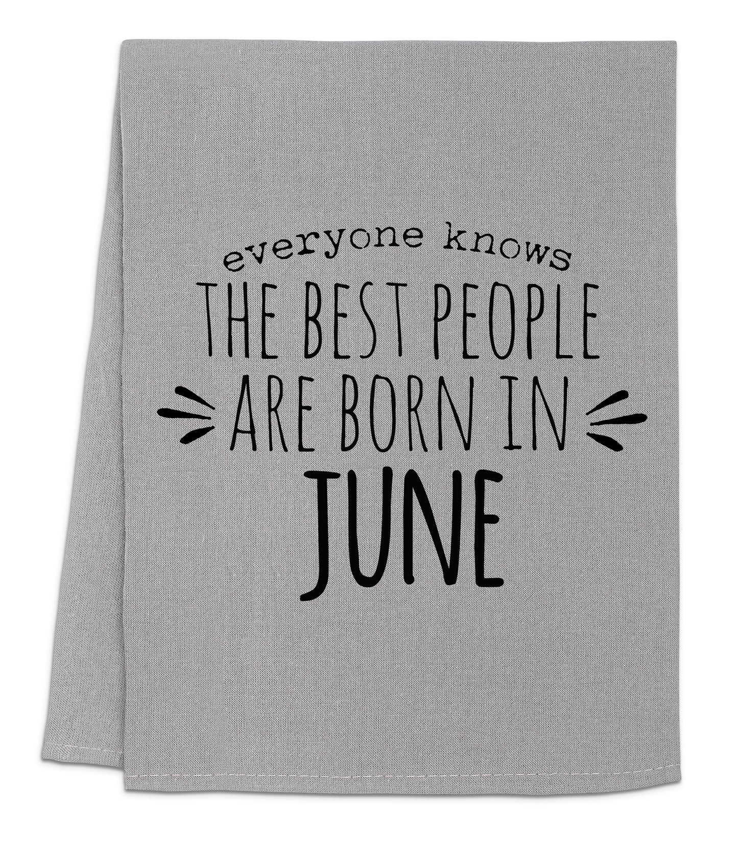 a gray towel with black lettering that says everyone knows the best people are born in