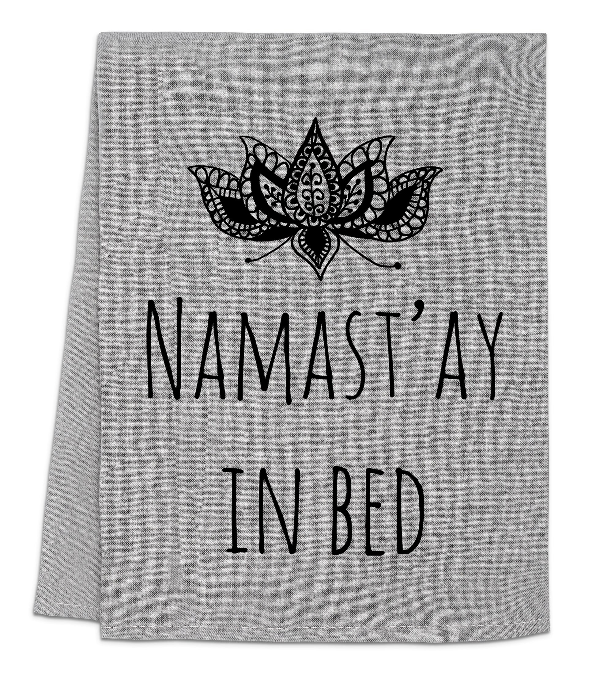 a towel that says namast'ay in bed