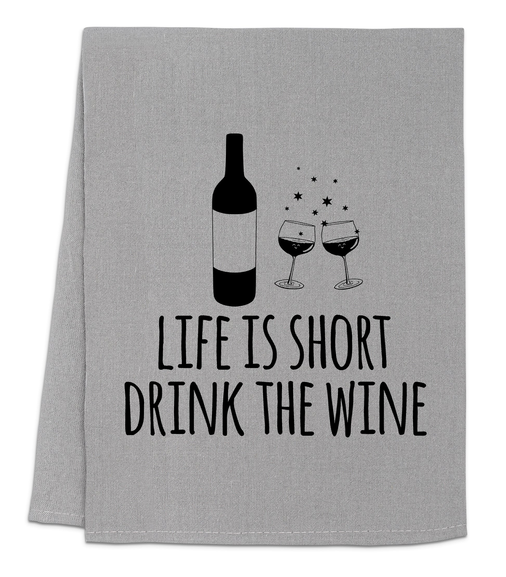 a towel with a bottle of wine and two glasses of wine