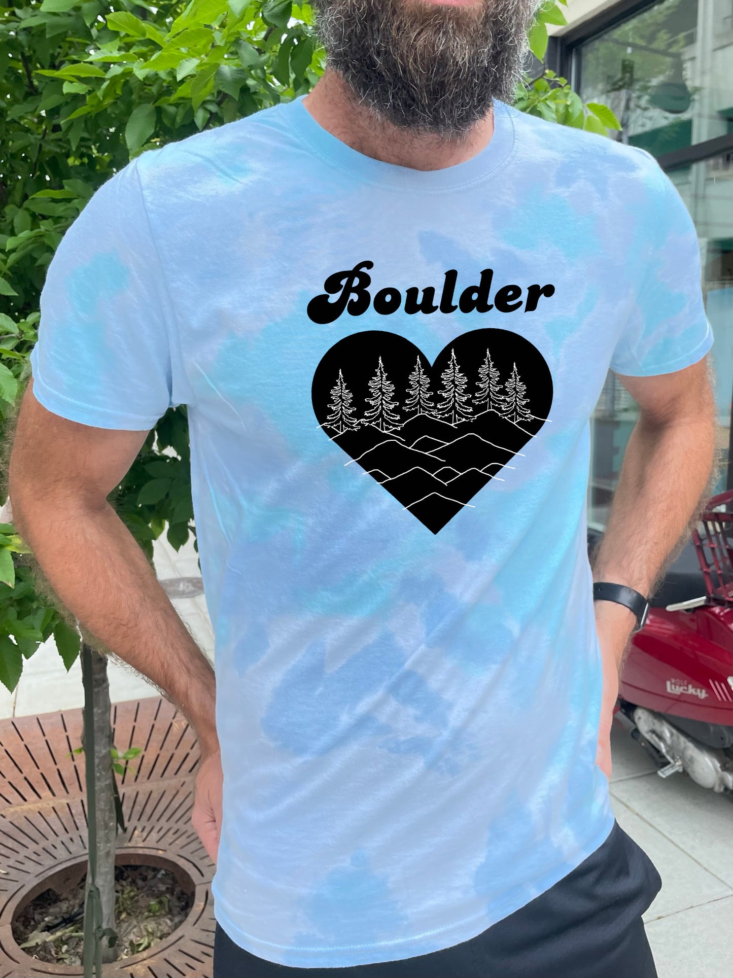 a man with a beard wearing a t - shirt that says boulder