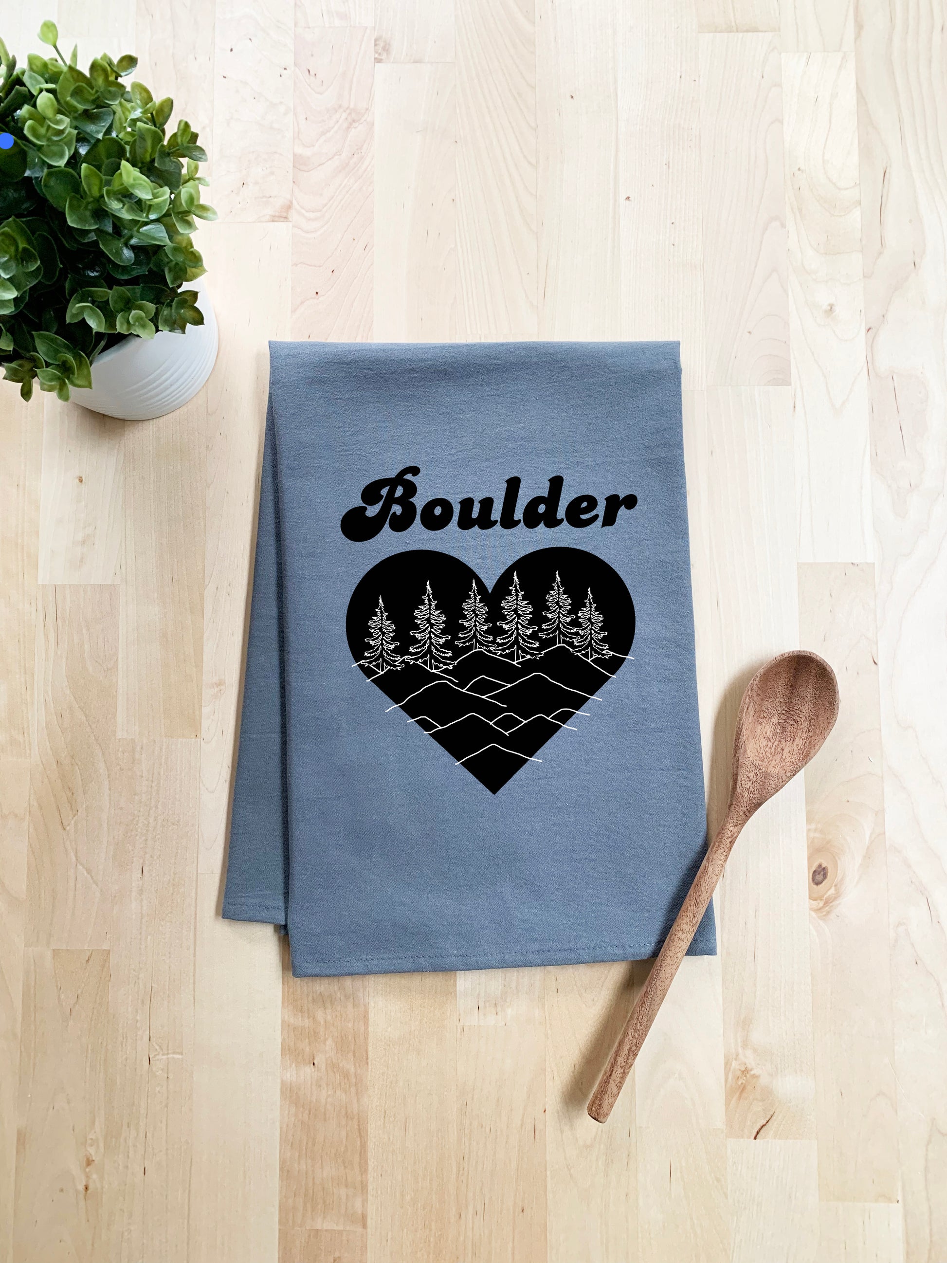 a tea towel with a heart and trees on it