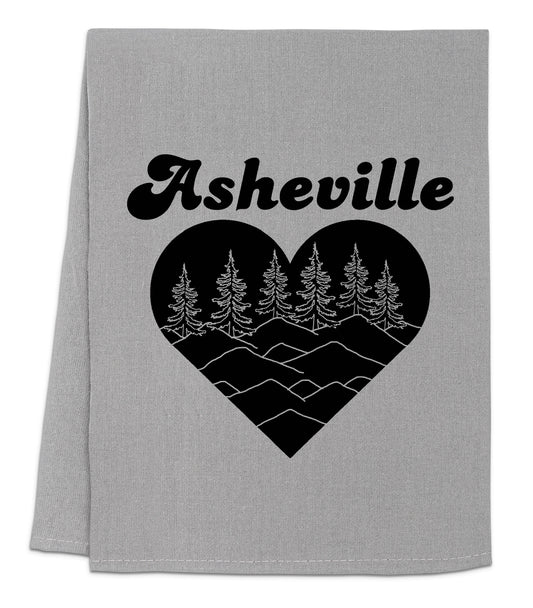 a grey towel with a black heart and trees on it