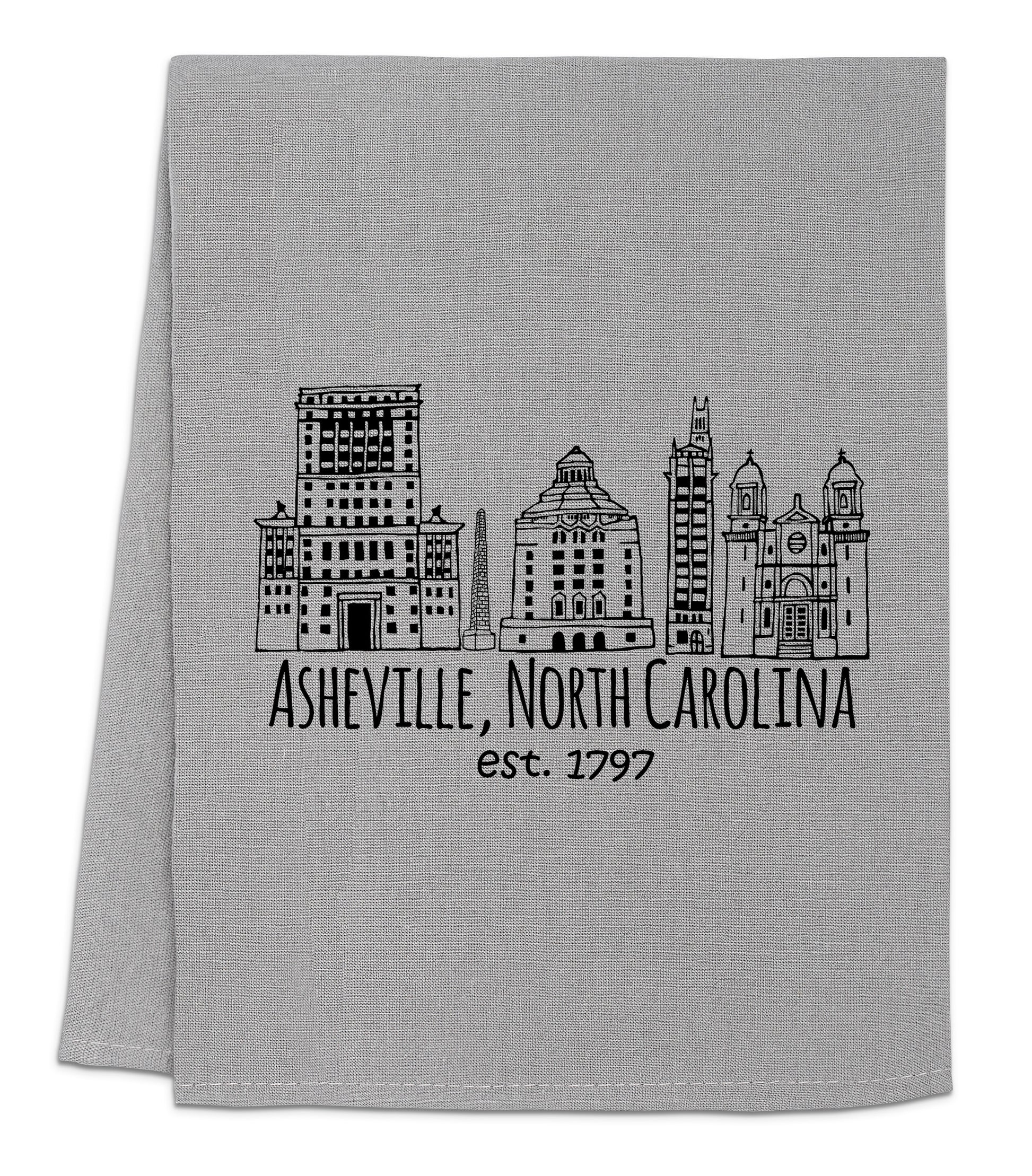 a gray towel with a black and white picture of a city