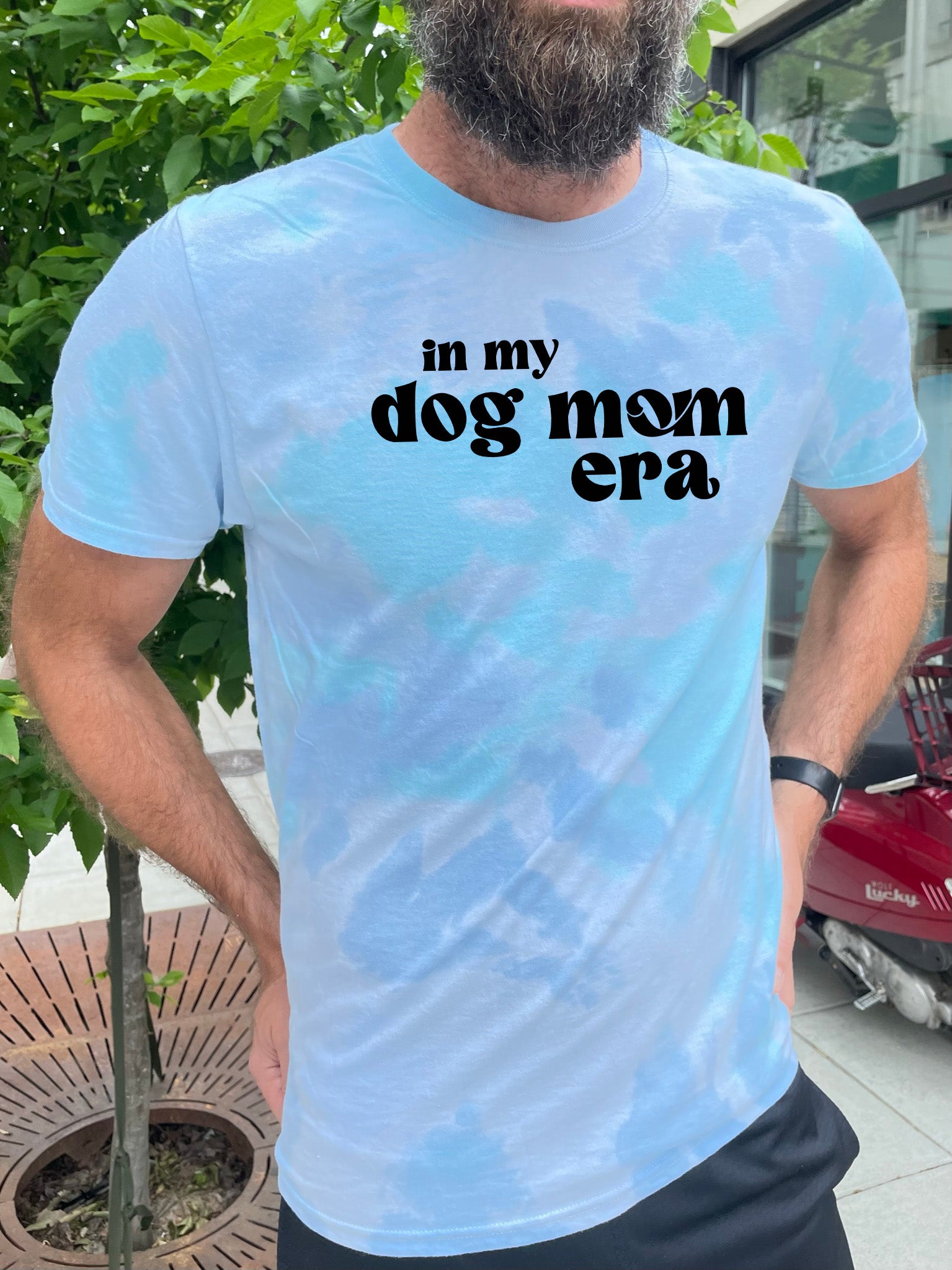 a man with a beard wearing a t - shirt that says in my dog mom