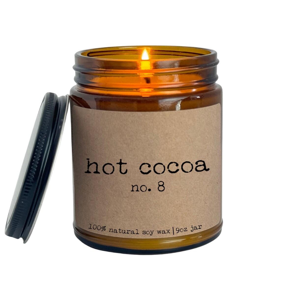 a candle with a label on it sitting in a jar