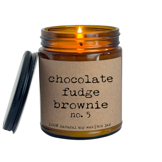 a jar of chocolate fudge brownie with a candle in it