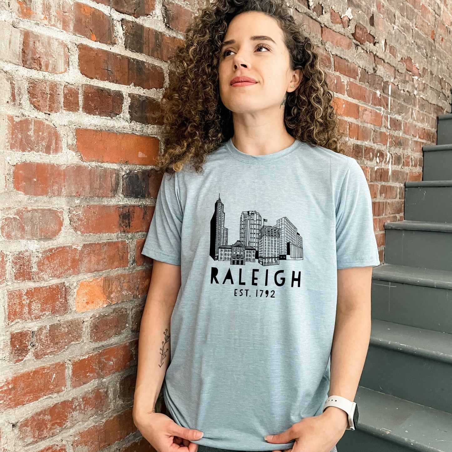 Raleigh Skyline (NC) - Men's / Unisex Tee - Stonewash Blue or Sage